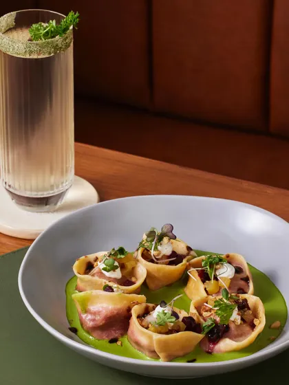 Our Beetroot Tortellini is the perfect comfort food for a chilly evening. The pasta is served with a sauce verdure, goat cheese, pickled beets, and toasted hazelnuts for a rich, earthy flavor.