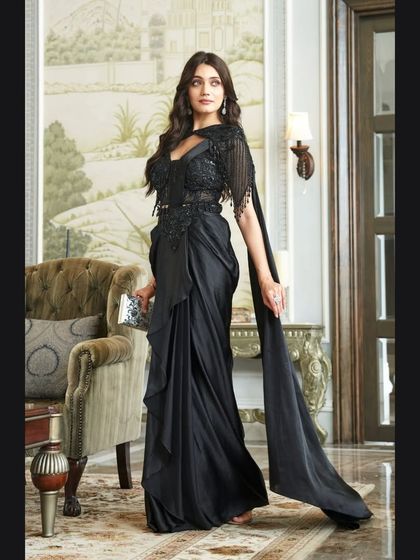 This shot shows the beautiful flow and drape of the black saree gown, making it look both elegant and easy to move in. A perfect rental for a cocktail party.