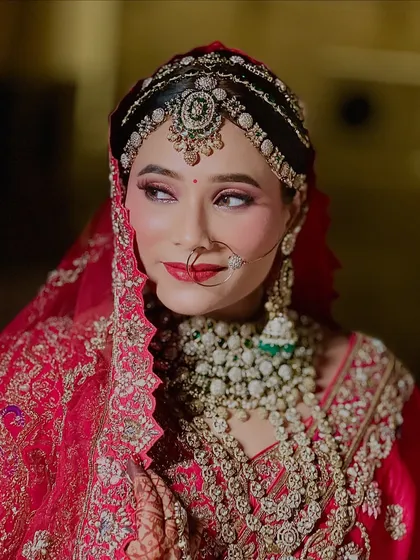 A side profile of my royal bride, showcasing the intricate details of her headpiece and the flawless blending of her eye makeup.