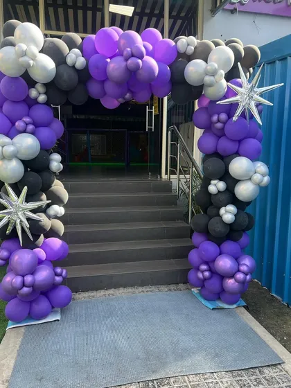 The entrance arch for our Wednesday theme party, setting a mysterious tone for the event.