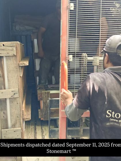 A view of our team loading a large wooden crate into a truck. We use robust packing materials to protect every piece during its journey.