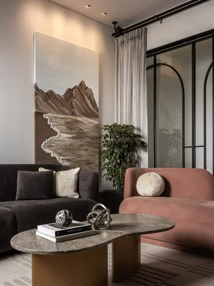 Once an open area, the family room is now a warm and inviting retreat. We introduced a refined partition with sliding doors for intimacy. Plush sofas in deep, accent-toned fabrics add richness, making it the perfect spot for the family to connect and unwind.