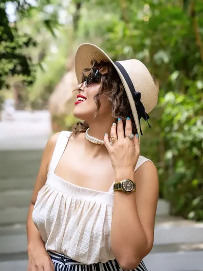 A classic, elegant portrait from the Olive Bistro shoot. The model's pose and accessories evoke a timeless beauty, perfectly matching the sophisticated ambiance of the location.
