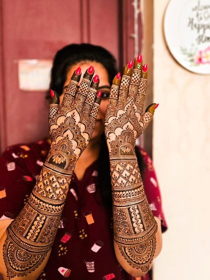 The full view of the engagement henna, showing the beautiful dome patterns on the back of the hands.