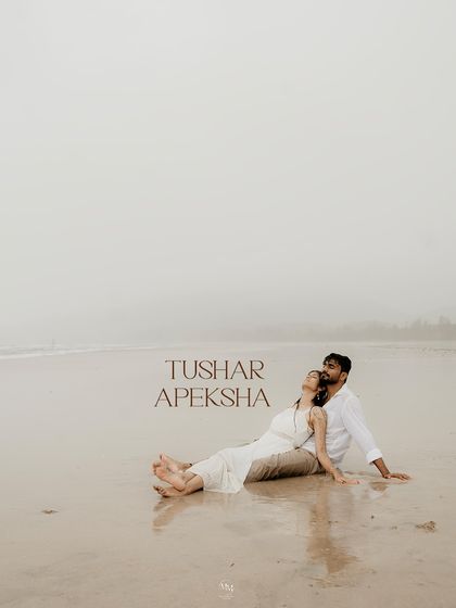 A serene portrait of the couple relaxing on the sand, with their names elegantly scripted. This shot feels like a poster for their own personal love story.