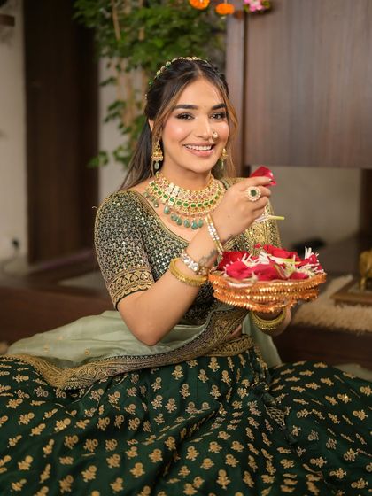 A playful shot with rose petals. The bride's fresh and flawless makeup is perfect for any festive occasion, providing a look that is both beautiful and long-lasting.