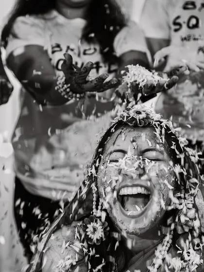 The pure, unfiltered joy of a haldi ceremony. We live for these moments of beautiful chaos, capturing the laughter and celebration with friends and family in timeless black and white.