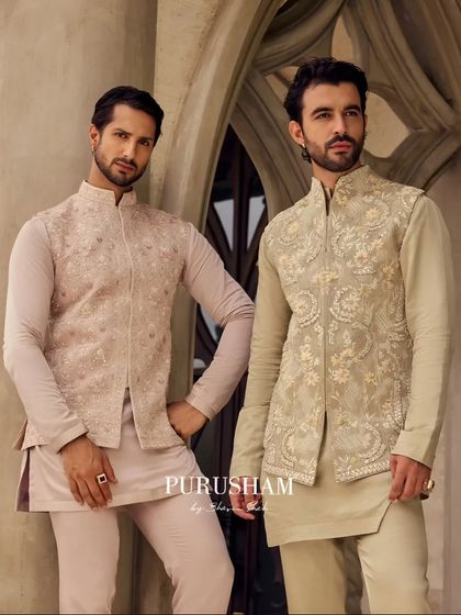 This image showcases two distinct yet complementary styles. The soft pink and pale olive jackets are perfect for groomsmen who want to look unified yet individual.