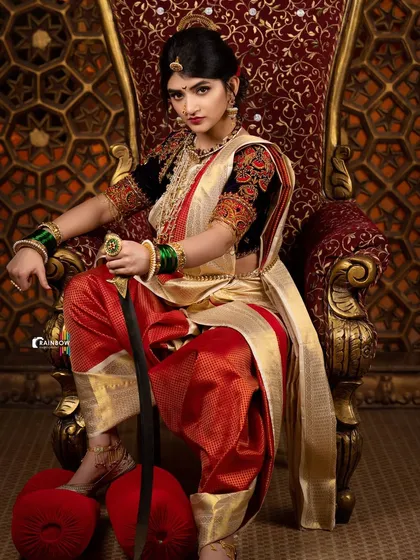 This image of Sreeleela shows the complete look, from the traditional footwear to the majestic pose, essential for fashion editorials.
