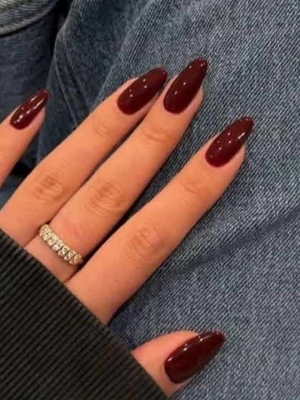 A classic deep red on long almond nails. This color is perfect for when you want to feel powerful and put-together.