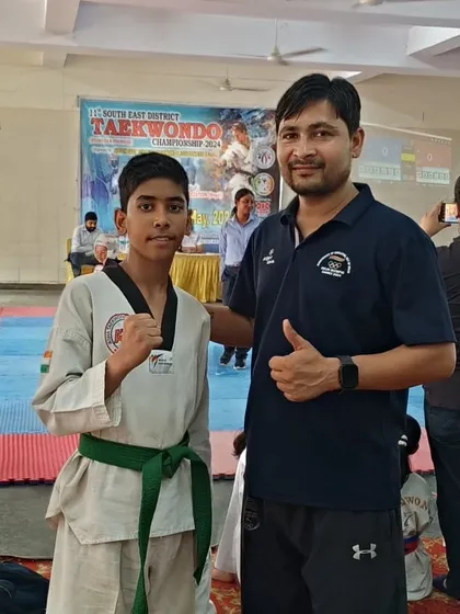 Posing with another one of our talented students at the district championship. Their determination is inspiring.