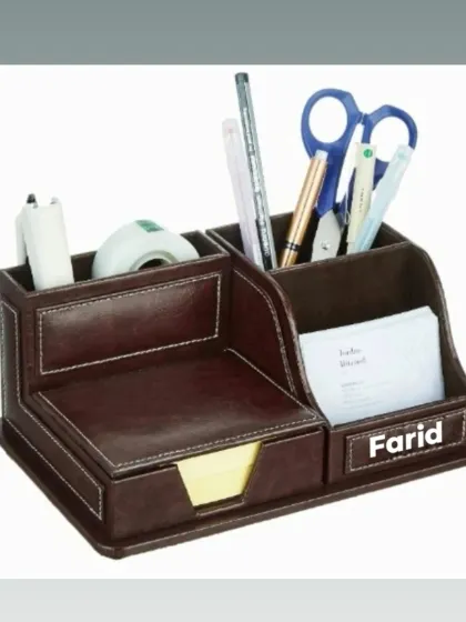 A personalized leather desk organizer, perfect for keeping a workspace tidy. It can be customized with a name.