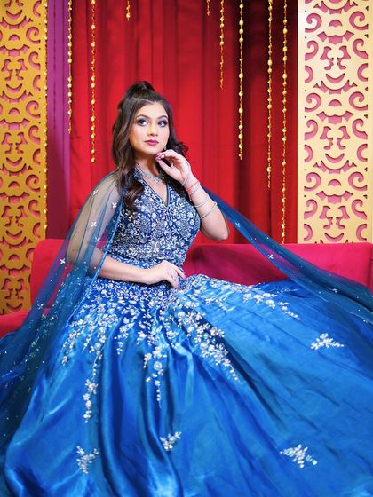 Another elegant seated pose in this gorgeous blue gown.
