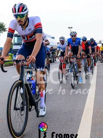 An elite rider, leading the peloton in a long and grueling race.