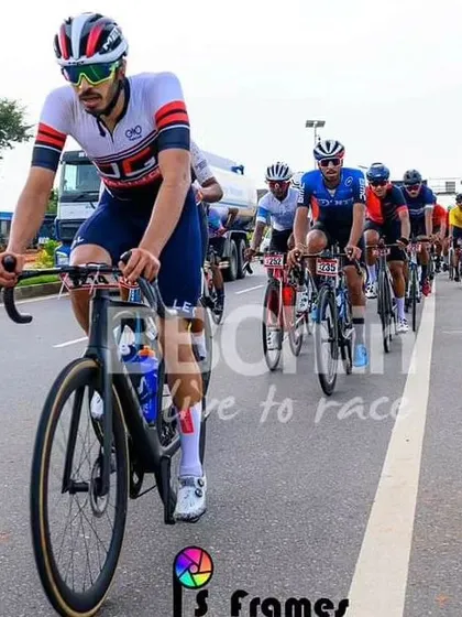 An elite rider, leading the peloton in a long and grueling race.