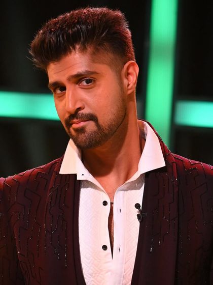 A close-up of Tanuj Virmani in another one of our creations for MTV Splitsvilla, a deep maroon embellished tuxedo jacket.