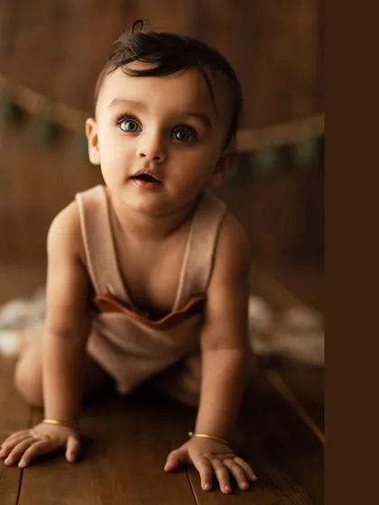 A close-up of this crawling pose, showing the determination and wonder in their eyes.