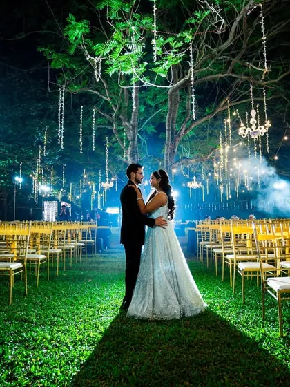 A romantic portrait of the couple on the empty dance floor after the party, under the magical lighting.