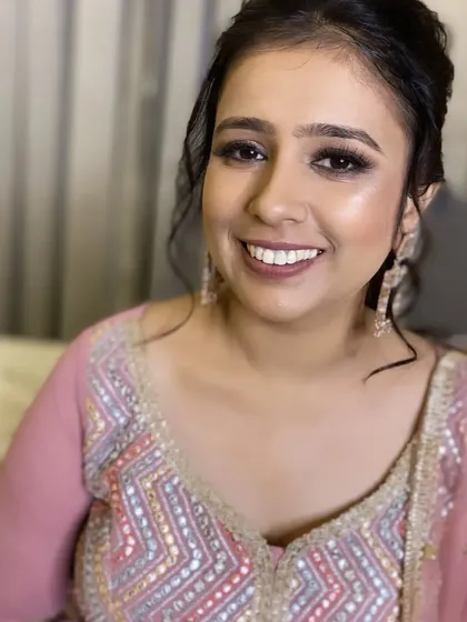 A close-up portrait of this cocktail party makeup. The focus is on flawless skin and beautifully defined eyes.