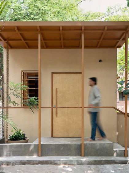 The clinic's design prioritizes the human nervous system, creating a dialogue between the urban context and the healing power of nature.