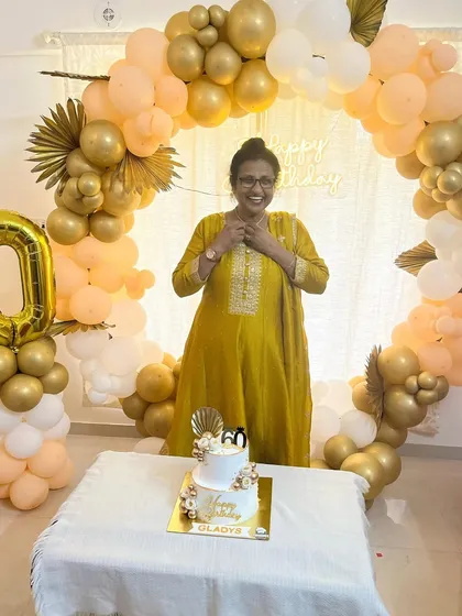 A full view of the 60th birthday party setup, with our cake as the beautiful centerpiece.