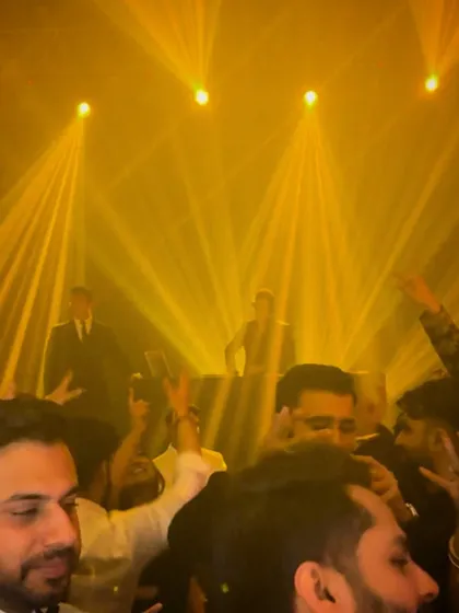 A view from the crowd as the lights create a spectacular effect. My aim is to build a party where every guest feels like they are part of the show.