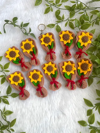 A collection of mini sunflower bouquet keychains. These are so cheerful and bright, perfect for sunflower lovers.