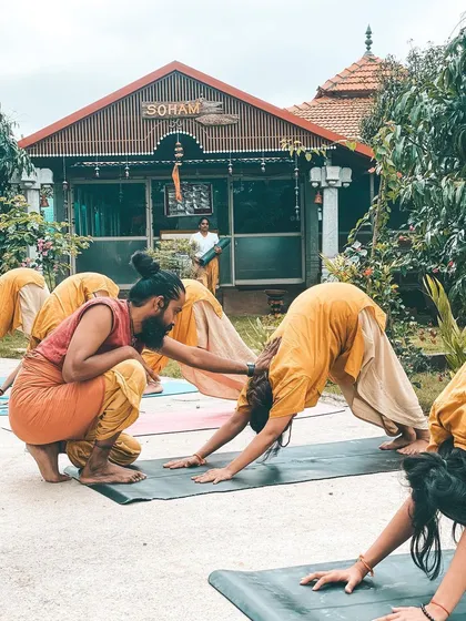 We take our practice into the embrace of nature whenever we can. Here, I am leading a class in Virabhadrasana I (Warrior I Pose) in the ashram garden. Practicing outdoors reminds us that we are part of something larger than ourselves, grounding our energy and strengthening our spirit.