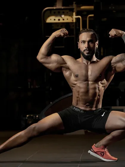 This classic bodybuilding pose shows the definition and symmetry that comes from a precise nutrition strategy. As a competitive bodybuilder, I know exactly how to manipulate diet to achieve peak physical condition for muscle growth.
