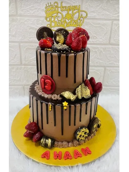 For the ultimate chocolate lover, this two-tiered drip cake is pure indulgence. It's loaded with fresh strawberries, Oreos, and chocolate shards, making it a hit at any birthday party.
