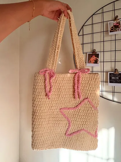 I’m obsessed with how this Pinterest-inspired tote bag turned out. The soft cream color, cute lavender bows, and star detail make it a dreamy accessory for carrying your essentials. It's all handmade with a cozy, plush texture.