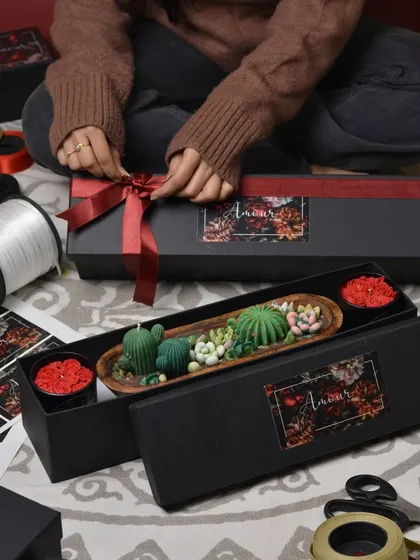 My 'Phool aur Kante' gift box is the perfect pick for thoughtful gifting. It combines the beauty of rose candles with the uniqueness of a cactus and succulent wooden bowl candle.