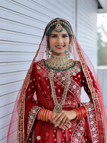 A full shot of the student's work on a North Indian bride, highlighting the complete look from head to toe.