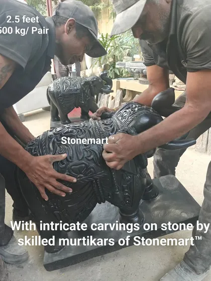 Our skilled murtikars add intricate carvings to a pair of 2.5-foot black marble elephant statues. Each elephant is carved from solid stone and the pair weighs 500 kg.