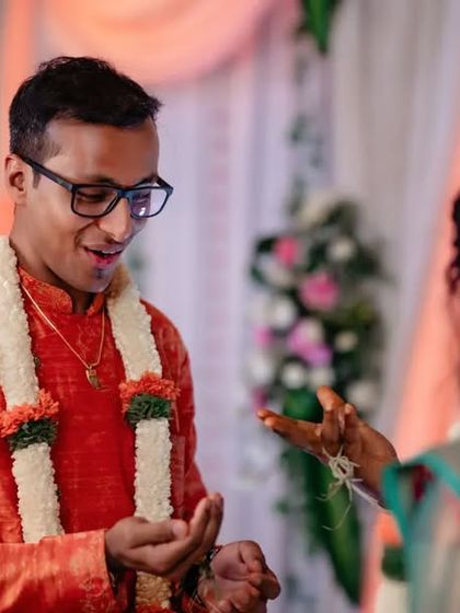 A candid moment of the groom during his engagement ceremony, sharing a laugh. We capture the relaxed and happy atmosphere of your event.