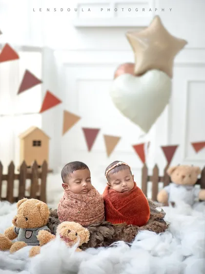 Double the joy, double the love. Photographing twins is a special challenge I adore, capturing two beautiful souls nestled together in a cozy, themed setup.