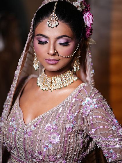 A close-up of this bride's elegant makeup. The focus is on her beautifully blended eyeshadow and flawless skin, creating a look that is both modern and timeless.