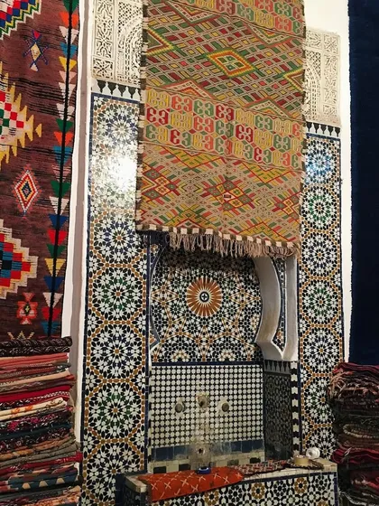 A snapshot from my travels showcasing the rich textures of Moroccan design. The vibrant, handwoven carpets are layered against intricate mosaic tilework, capturing the essence of a culture where craftsmanship and storytelling are part of everyday life.