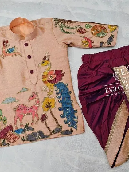 A full view of the hand-painted Kalamkari kurta and dhoti set. The intricate artwork makes this a truly special outfit.