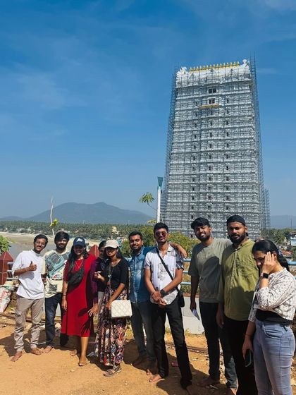 Posing in front of the Murudeshwar temple on a clear sunny day.