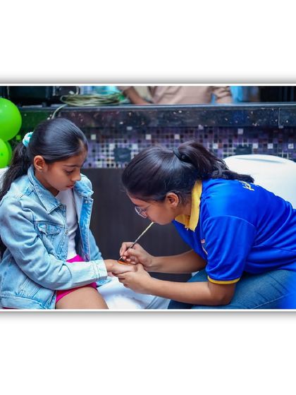 A close-up of a temporary tattoo being applied. It's a simple, painless, and fun way for kids to get a little bit of body art.