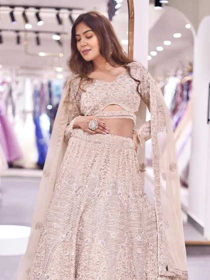 Make a regal statement with this intricately embellished lehenga, crafted to make your festivities unforgettable.
