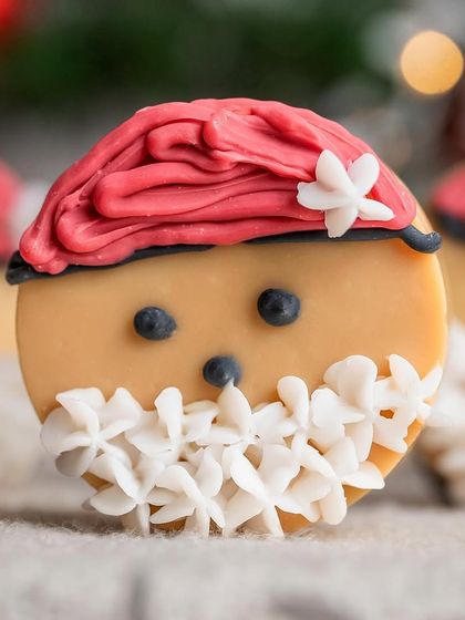 A detailed macro shot of a Santa-themed Christmas soap. This close-up highlights the incredible, intricate piping work that makes the product so unique and festive.