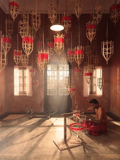 The weaver's workshop, imagined as a sacred space. The art direction for this Kanakavalli campaign involved creating installations from weaving equipment, celebrating the craft itself.