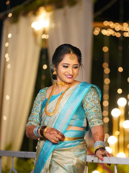 A lovely look in a light blue saree, perfect for an evening engagement or pre-wedding dinner.