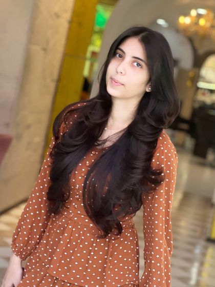 A perfect example of the butterfly haircut. The shorter layers around the face and longer layers in the back create a beautiful, feathered effect.