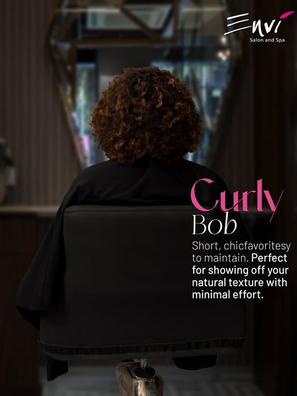The Curly Bob. This short, chic, and easy-to-maintain style is perfect for showing off your natural texture with minimal effort. We cut it to enhance your curl pattern beautifully.
