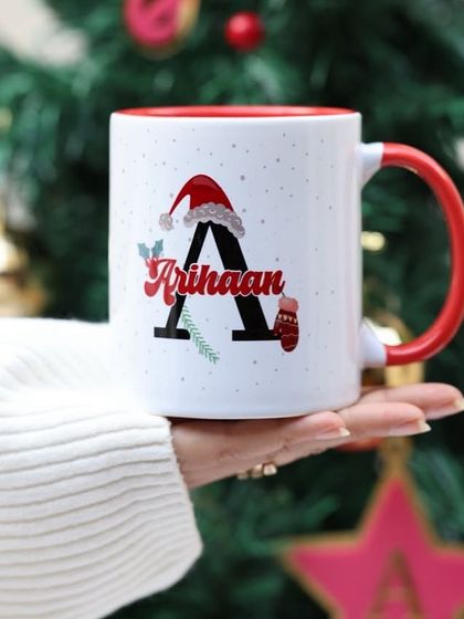We also offer a festive initial design for our Christmas mugs. It's a simple yet elegant way to add a personal touch to your holiday gifting.