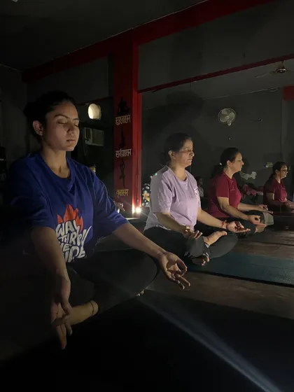 A side view of my students in a row, all absorbed in their meditation practice.