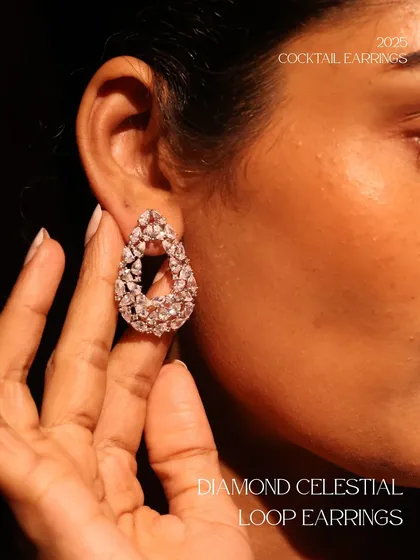 The Diamond Celestial Loop Earrings, a contemporary and chic cocktail earring design. The open pear shape is fully encrusted with diamonds for maximum sparkle.